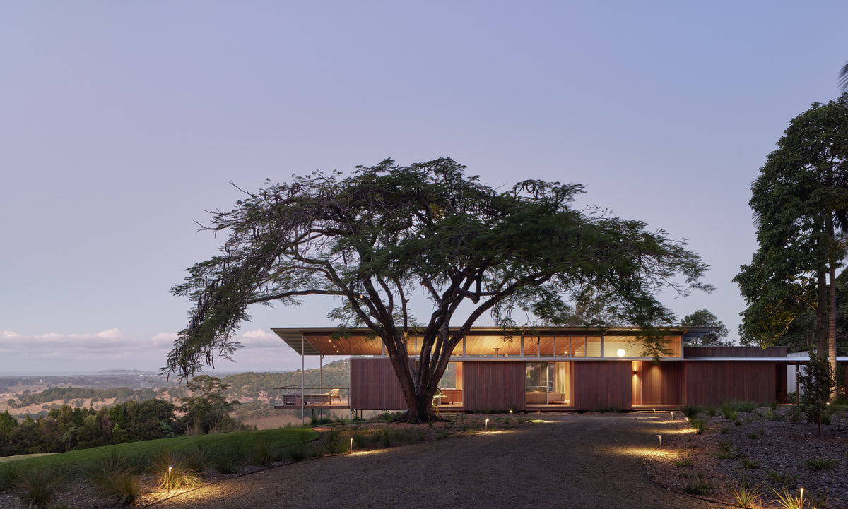 Hillside architectural home — dusk exterior view